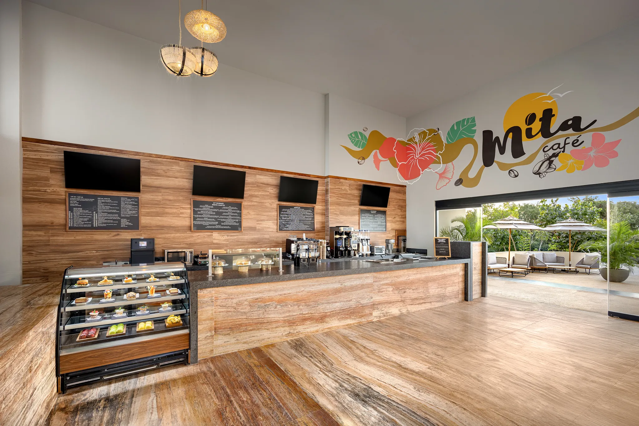 Café Mita at Secrets Bahia Mita Surf & Spa Resort featuring a modern café counter with premium coffee, fresh pastries, and relaxed indoor seating.