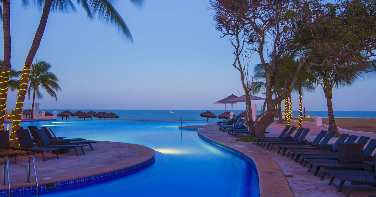 Dreams Villamagna Nuevo Vallarta family-friendly all-inclusive resort with beachfront pools, lush gardens, and Banderas Bay views.