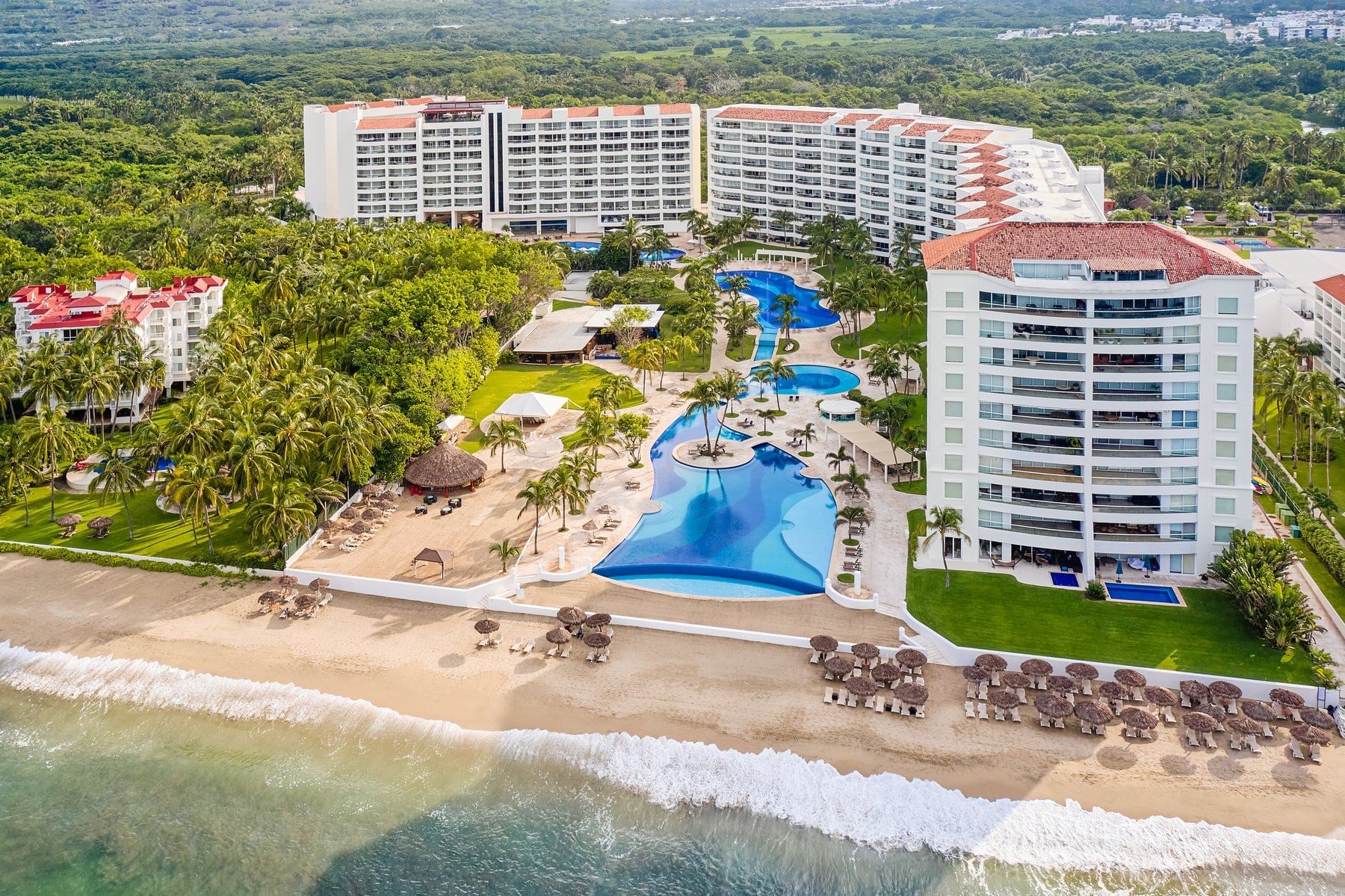Fiesta Americana Puerto Vallarta all-inclusive resort with beachfront pools, tropical gardens, and family-friendly amenities on Banderas Bay.