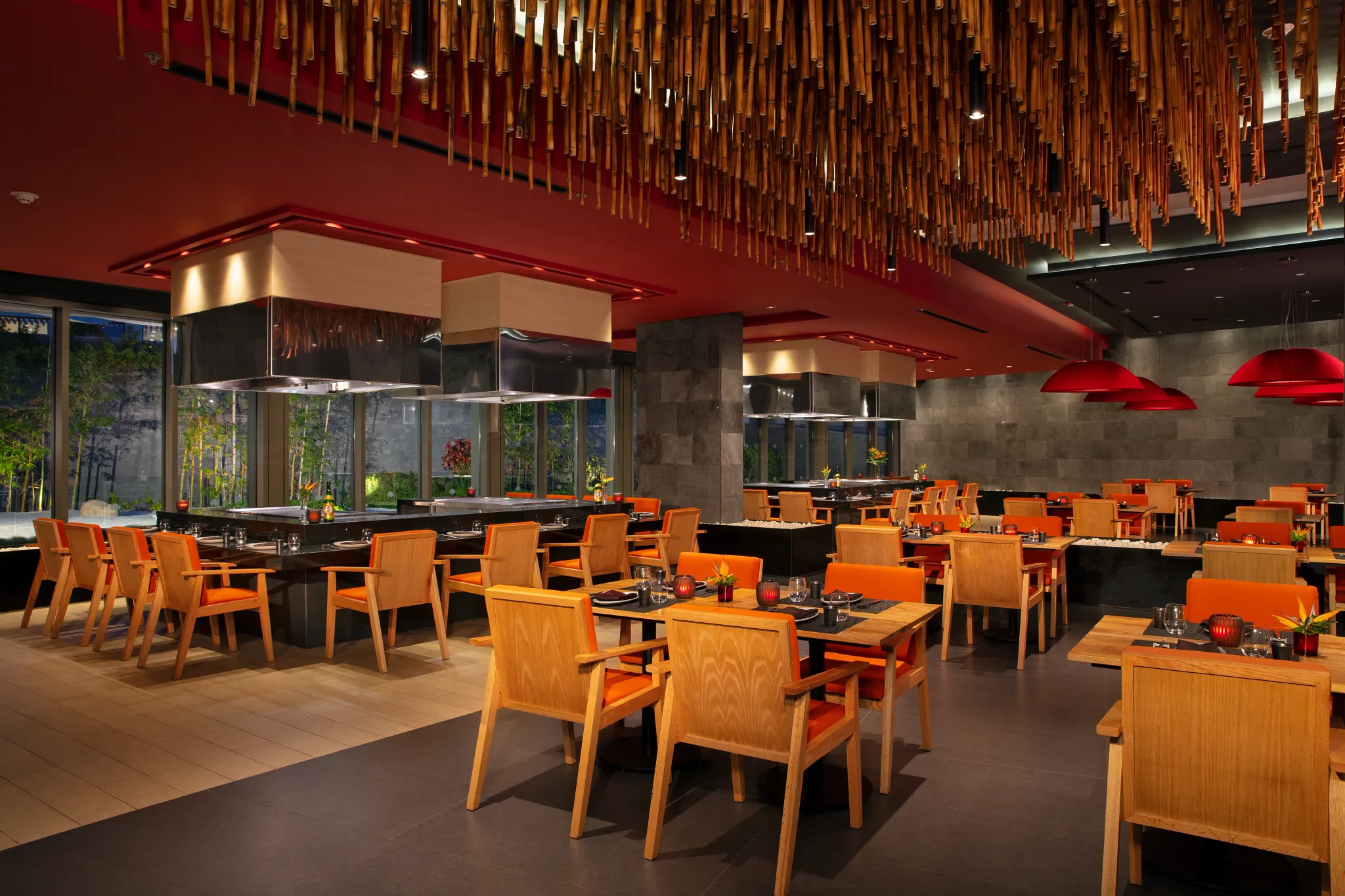 Himitsu Pan-Asian Restaurant at Secrets Bahia Mita Surf & Spa Resort featuring hibachi tables, modern Asian décor, and a vibrant dining atmosphere.