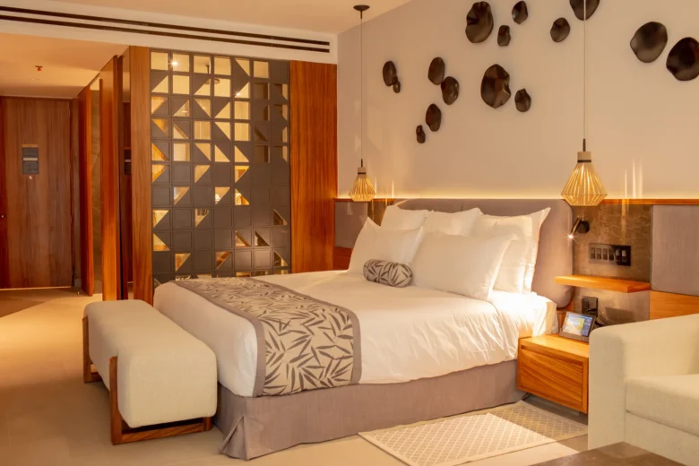 Junior Suite Panoramic View with king-size bed and elegant furnishings at Secrets Bahia Mita Surf & Spa Resort.