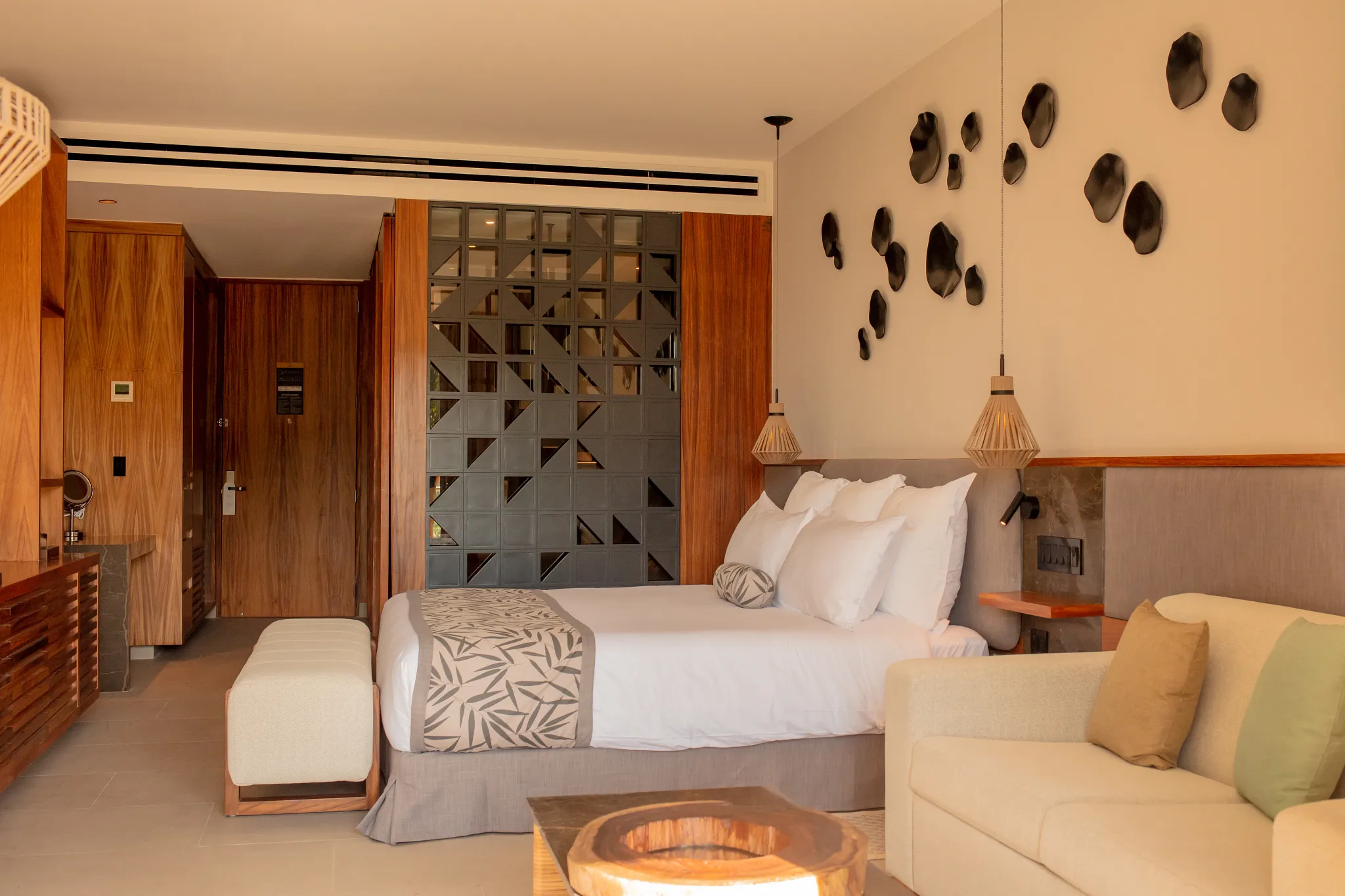 Junior Suite Panoramic View seating area with private furnished balcony at Secrets Bahia Mita Surf & Spa Resort.