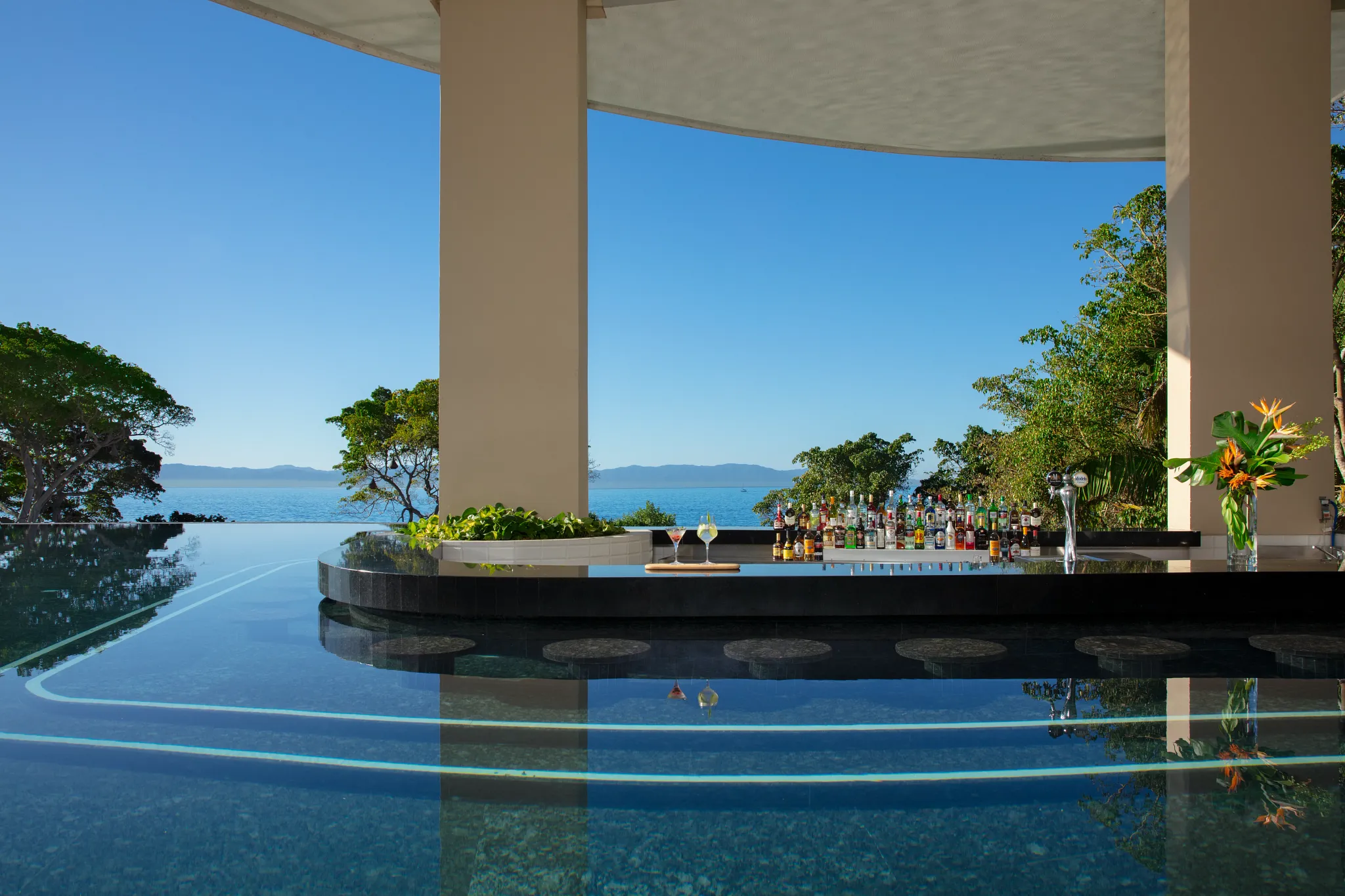 Manatees Swim-Up Bar at Secrets Bahia Mita Surf & Spa Resort featuring an in-pool bar with ocean views and refreshing tropical cocktails.