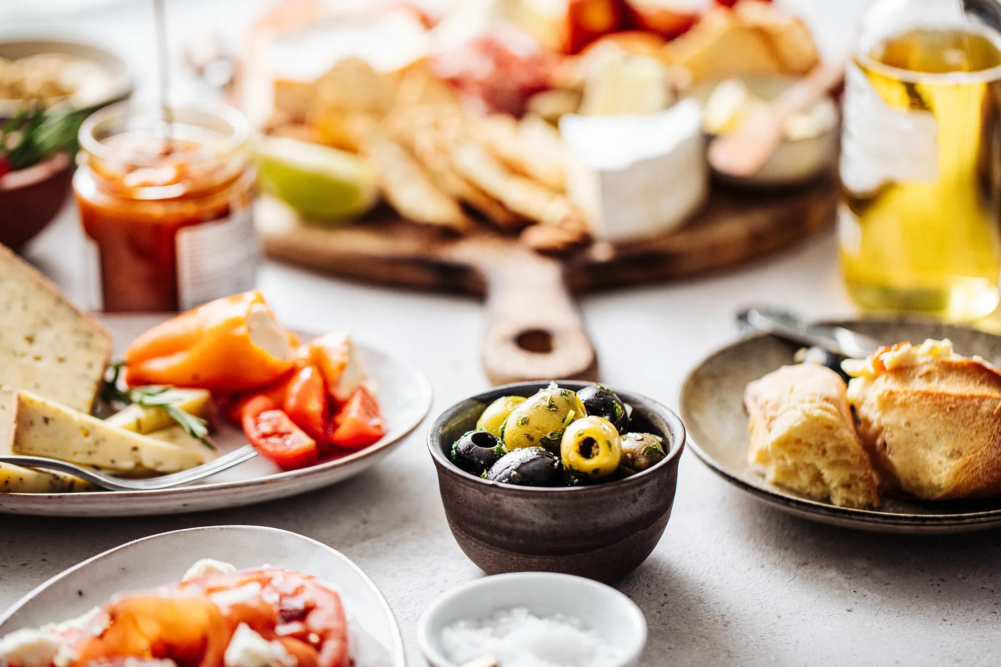 Mezes Mediterranean Restaurant at Secrets Bahia Mita Surf & Spa Resort featuring shared plates inspired by Mediterranean flavors and artfully presented dishes.