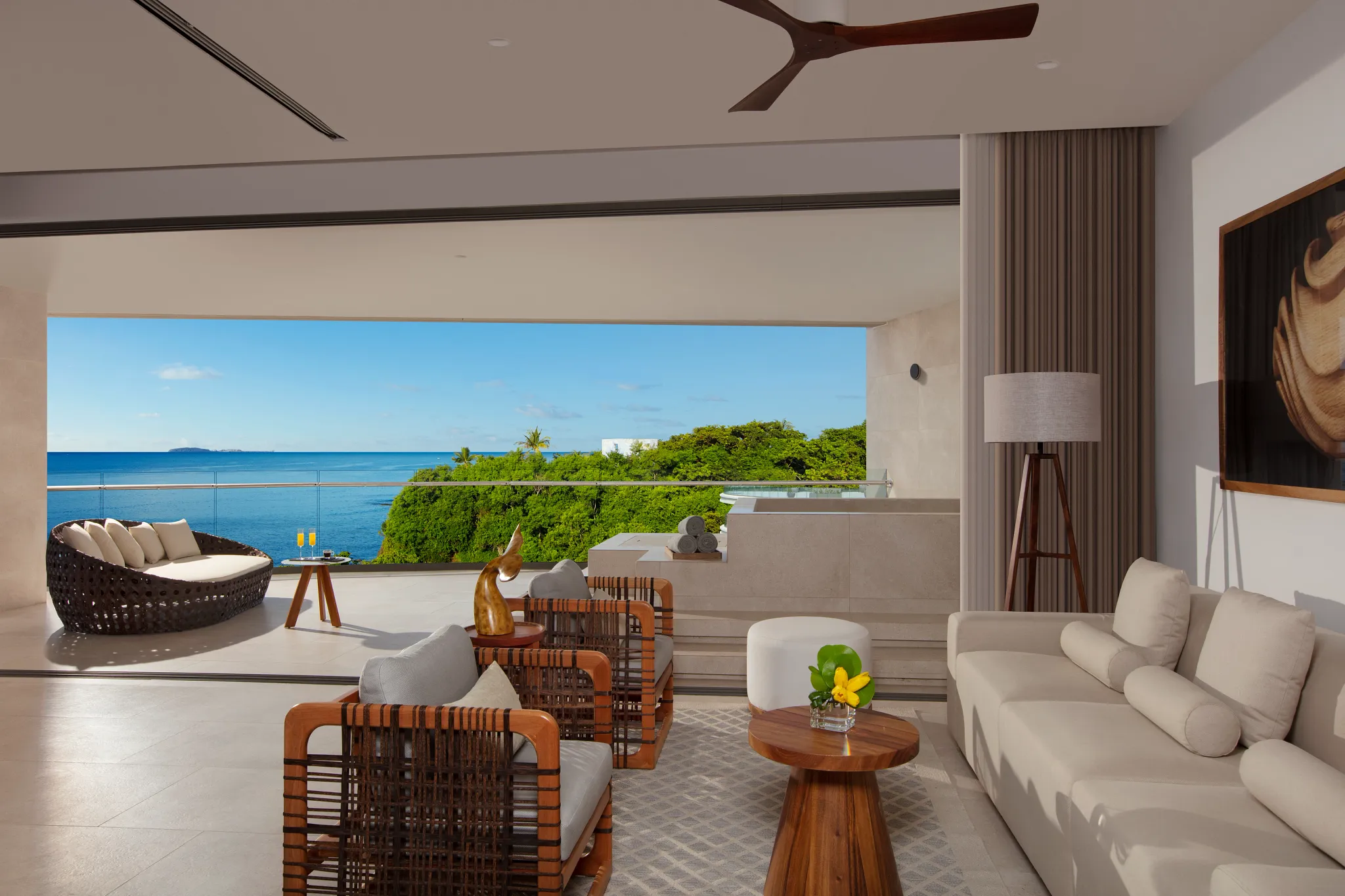 Preferred Club Bahia Mita Suite Ocean Front living room with expansive terrace and ocean views at Secrets Bahia Mita Surf & Spa Resort.