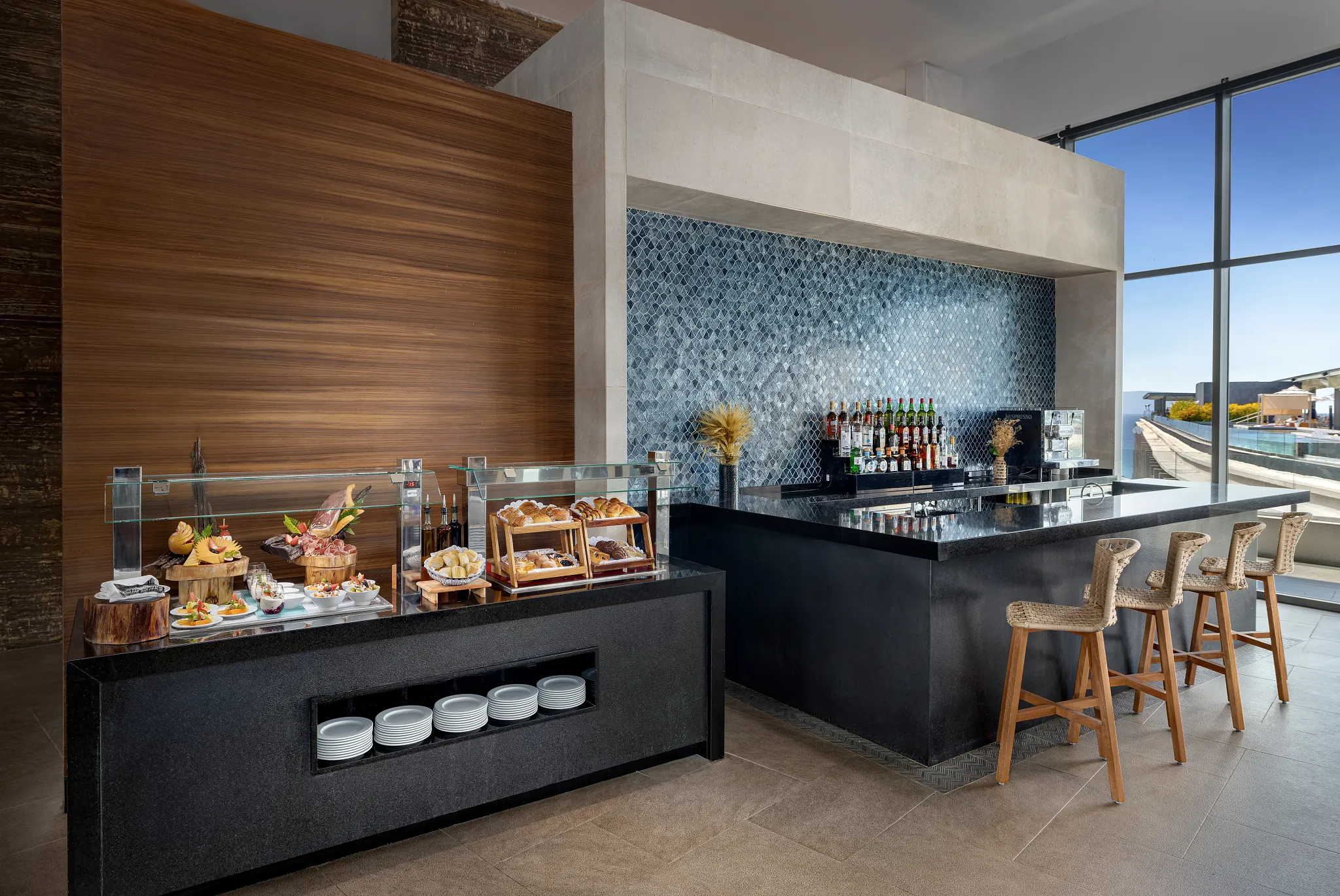 Preferred Club Bar at Secrets Bahia Mita Surf & Spa Resort featuring an exclusive lounge bar with top-shelf spirits, modern décor, and oceanview seating.