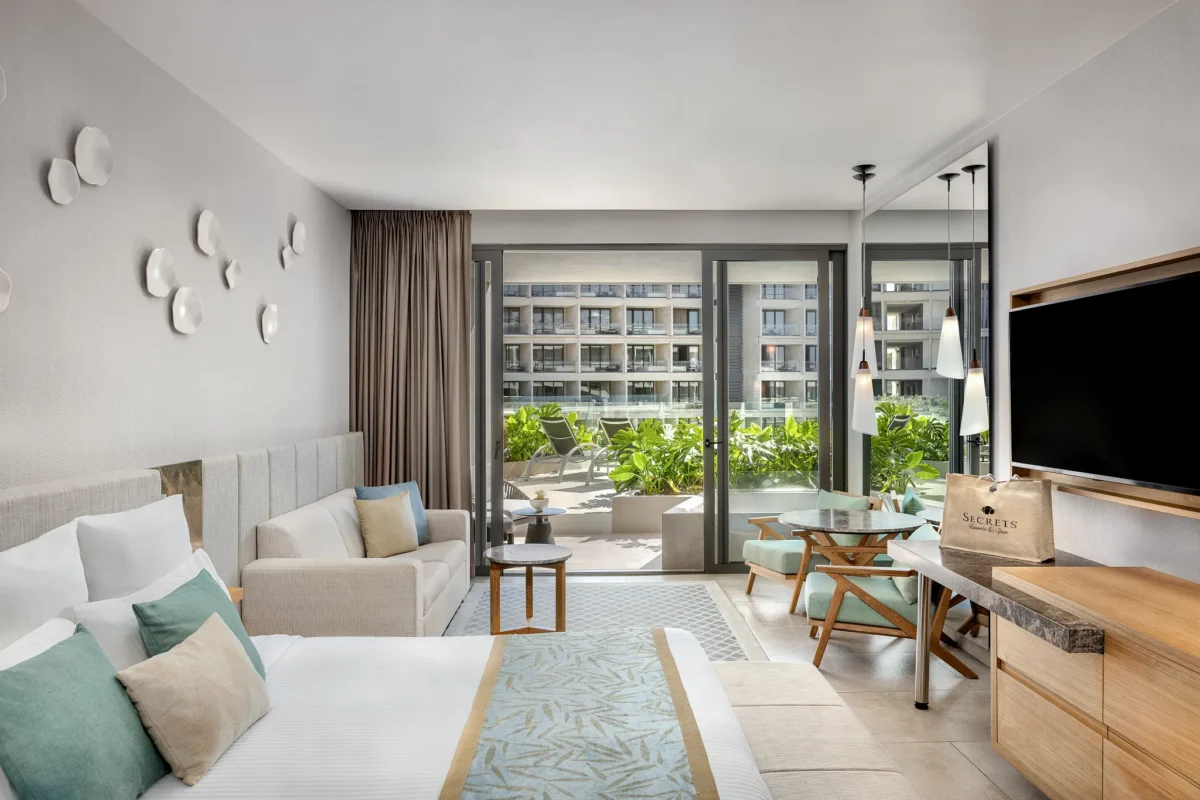 Preferred Club Junior Suite Sun Deck with king bed and private terrace at Secrets Bahia Mita Surf & Spa Resort.