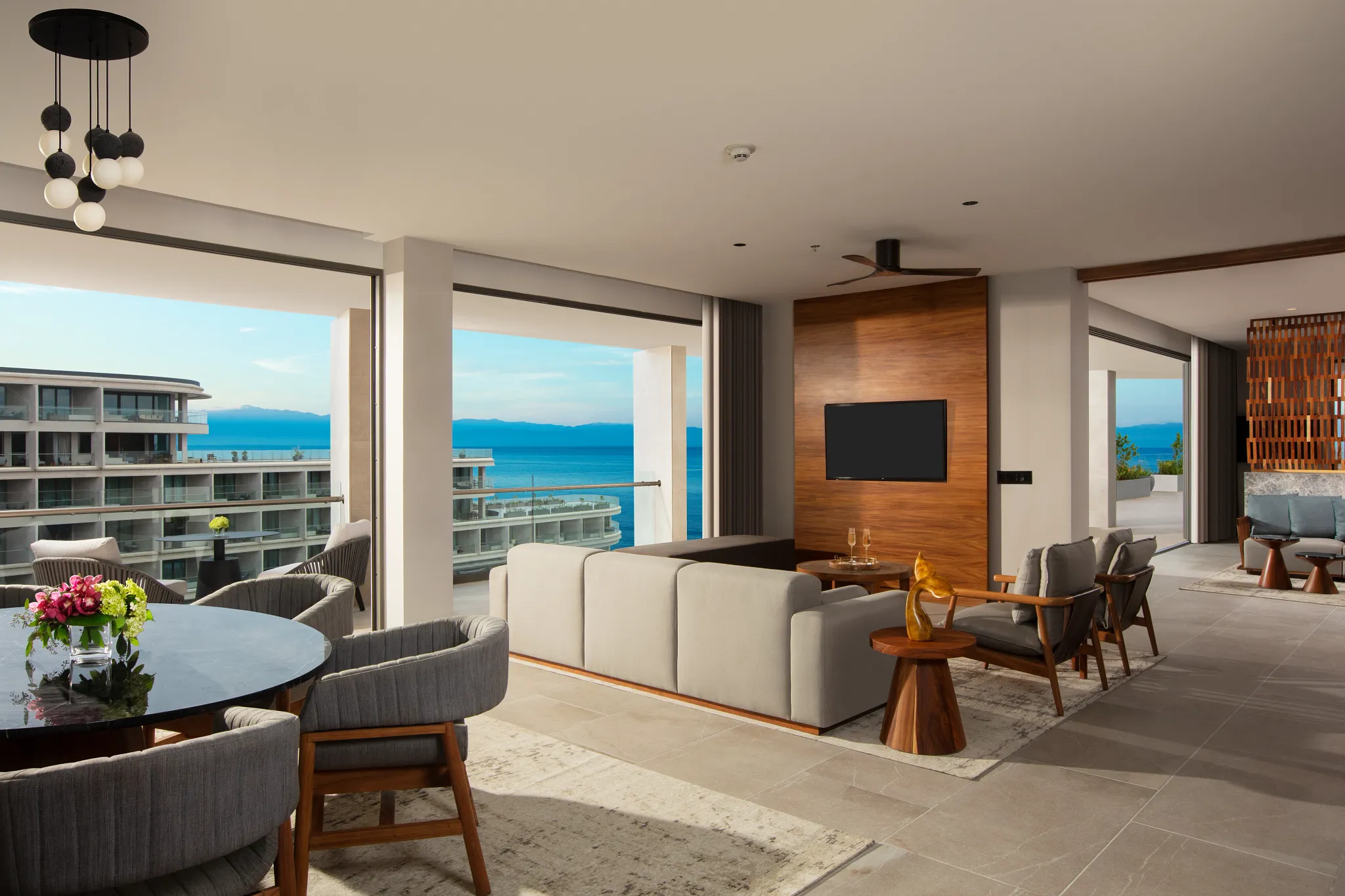 Preferred Club Presidential Suite Ocean View living area with floor-to-ceiling windows at Secrets Bahia Mita Surf & Spa Resort.