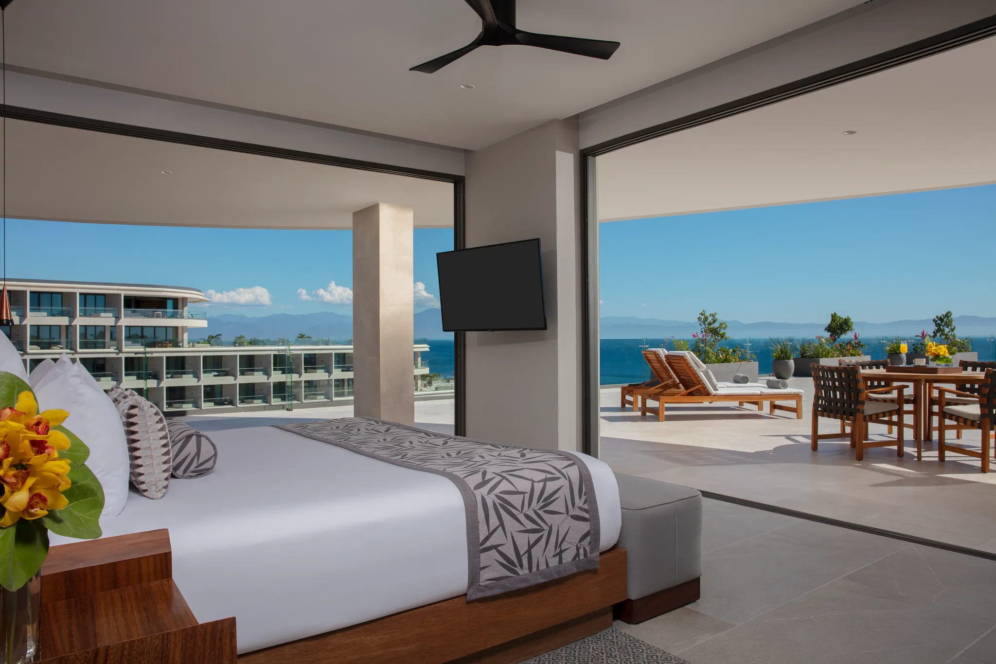 Preferred Club Presidential Suite Ocean View master bedroom with king bed and terrace access at Secrets Bahia Mita Surf & Spa Resort.
