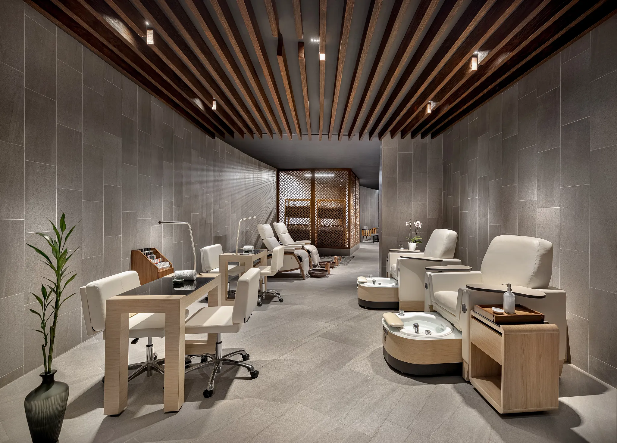 Luxury spa salon with pedicure stations at Secrets Bahía Mita Surf & Spa Resort, offering modern wellness and beauty treatments.